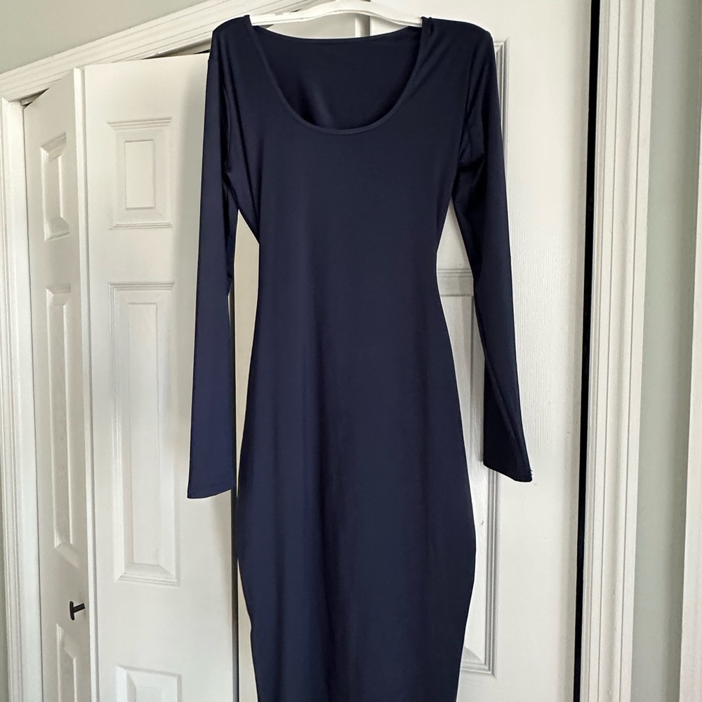 Dark navy blue long sleeve stretch part open back midi dress . Medium in size
